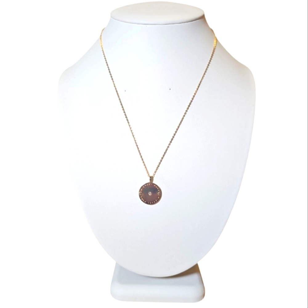 Signed Gold Tone Michael Kors Signiture Elegant Pendant Necklace.